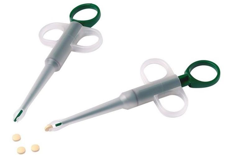 Un dispositif pour administrer des pilules à un chien